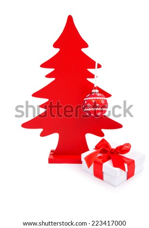 Christmas greeting card. Wooden Red Christmas Tree with christmas gift box and bow. Isolated, over white background with copy space.