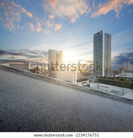 Uphill asphalt road with modern buildings and skyscrapers on the midtown Royalty-Free Stock Photo #2234176751
