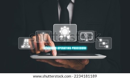 SOP,  Standard Operating Procedure concept, Businessman hand touching digital tablet with SOP icon on virtual screen. Royalty-Free Stock Photo #2234181189