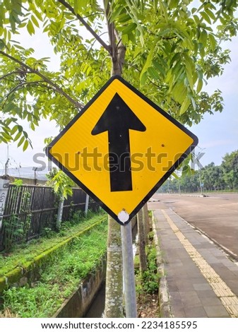 One direction sign, traffic sign, road sign photo on a black and yellow