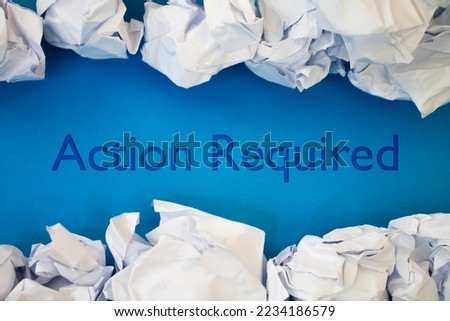 Action Required text with Torn, Crumpled White Paper on colored background.