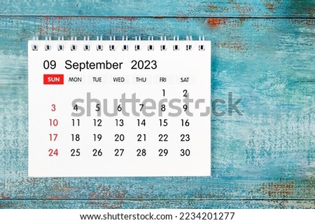 September 2023 Monthly desk calendar for 2023 year on old blue wooden background. Royalty-Free Stock Photo #2234201277