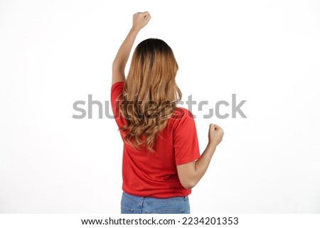 Studio shot of female asian soccer fans with red t-shirt isolated on white background. rear or back view Royalty-Free Stock Photo #2234201353