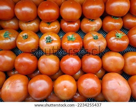 a bunch of tomatoes in supermarket