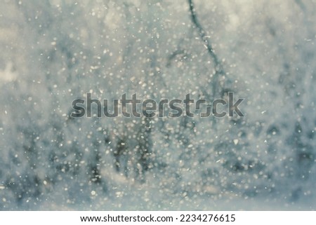 Close up sparkling falling snowflakes in air concept photo. Winter wonderland. Front view photography with blurred background. High quality picture for wallpaper, travel blog, magazine, article