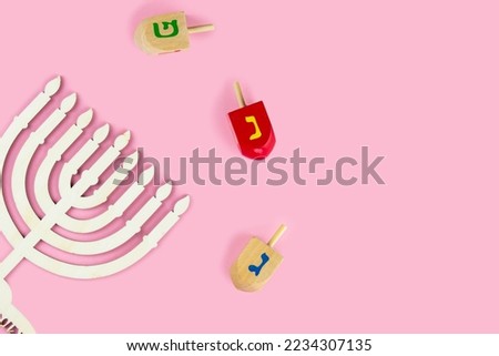 Jewish holiday Hanukkah concept. Menorah - traditional candelabrum or hanukkiah, and wooden dreidel - spinning top
