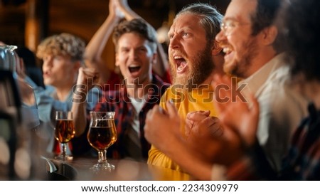 Soccer Club Members Cheering for Their Team, Playing in an International Cup Final. Supportive Fans Sitting in a Bar, Cheering, Handshaking and Shouting. Friends on a Night Out in a Pub. Royalty-Free Stock Photo #2234309979