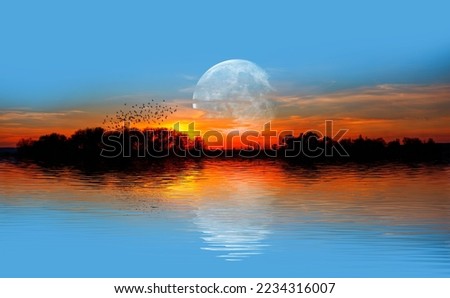 Silhouette of birds flying over the lake with full moon at sunset "Elements of this image furnished by NASA "