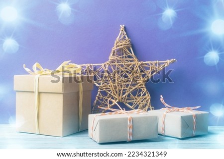 Handmade star and craft gift boxes made of zero waste materials over holiday background. Handmade crafts from eco-friendly materials. Christmas and New Year greeting