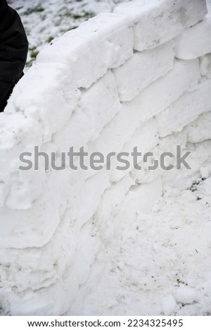 Snow wall. A piece of a fortress made of snow. snow games