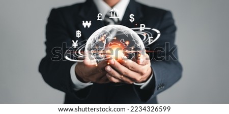 Online banking interbank payment concept. Businessman with virtual global currency symbols in hand. Money transfers and currency exchanges between countries of the world.