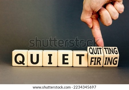 Quiet quitting or firing symbol. Concept words Quiet quitting Quiet firing on cubes. Businessman hand. Beautiful grey table grey background. Business quiet quitting or firing concept. Copy space. Royalty-Free Stock Photo #2234345697