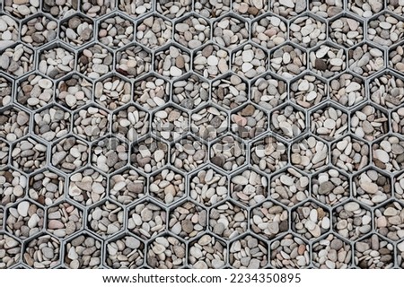 pebble stone in cells. background. landscaping of territories