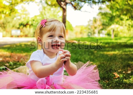 Young girl playing at park, celebrating her first birthday -- image taken at San Rafael park in Reno, Nevada, USA