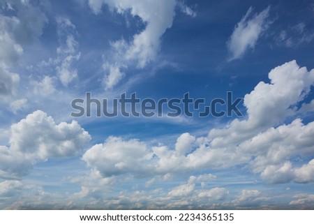 Panorama of daytime sky with clouds. Sky background, daylight sky with lighted clouds. Beauty clouds over sea