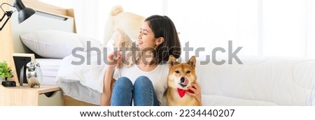 Banner cover design. Young Asian woman playing with three dogs (brown shiba inu, white shiba puppy and white maltese)in bedroom. Cheerful and nice couple with people and pet. Pet Lover concept