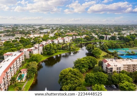 Aerial drone view to the suburbs in Delray Beach in Miami Florida, there is large tropical vegetation, houses with tiles Royalty-Free Stock Photo #2234448525