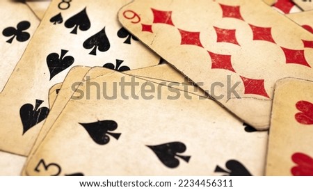 old yellowed poker cards. background or texture