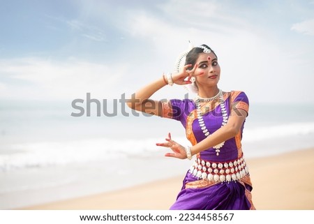 Indian woman traditional Dancers in the posture of Indian classical dance odissi.  Royalty-Free Stock Photo #2234458567