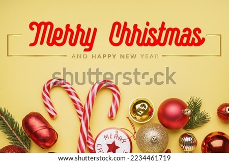 Beautiful greeting card for Christmas and New Year with decor on yellow background
