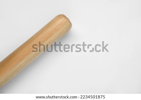 Wooden baseball bat on white background, top view with space for text. Sports equipment