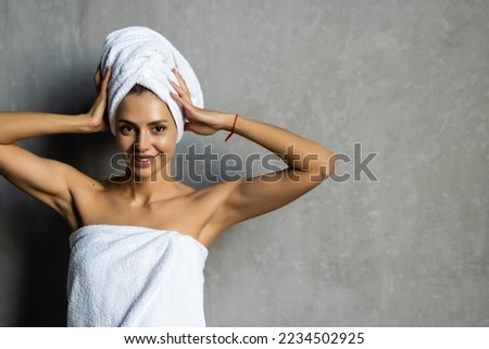 Young healthy serene woman girl relaxing in bathrobe and spa towel after having bath shower at home. Beauty treatment, rest and body care procedures. Royalty-Free Stock Photo #2234502925