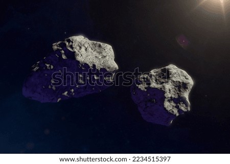 Asteroids or a meteorites flies in space, against the background of nebulae and stars. Science fiction art. High resolution space background.  Elements of this image furnished by NASA.