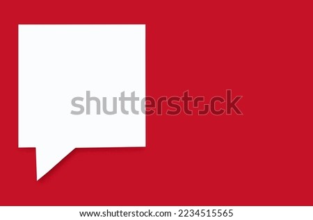 Paper speech bubble in the shape of a square on a red isolated background. Flat white chat icon in the form of an empty speech bubble. Free space for text or image. Internet communication concept