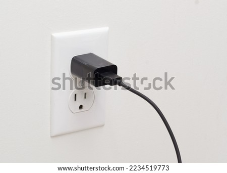Electrical wall outlet and usb adapter plug Royalty-Free Stock Photo #2234519773