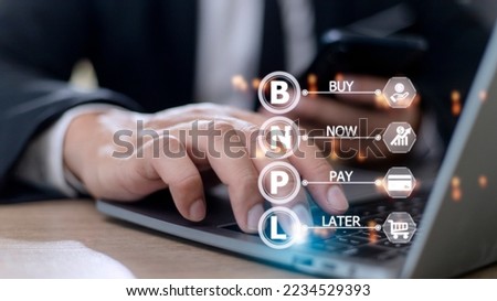 Businessmen holding a smartphone with icons of BNPL with online shopping icons technology. BNPL Buy now pay later online shopping concept. Royalty-Free Stock Photo #2234529393