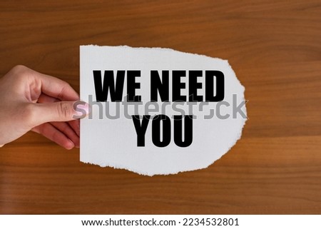 We need you. Woman hand holds a piece of paper with text. Recruitment, searching, job opprtunity, hiring, team, employment and labour. 