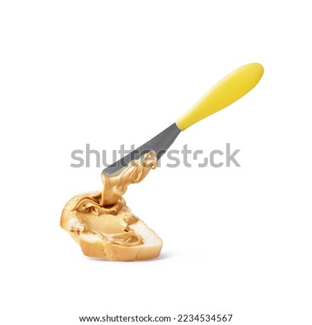 peanut butter spread with a knife on a white background