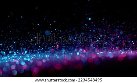 Neon bokeh background with various colors on black. Blur halftone glitter texture. Blurry night lights retro glow.