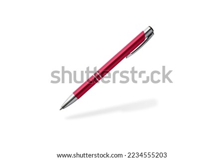 Red pen flying isolated on white background. Metallic ball pen in trendy color 2023 Viva Magenta with shadow Royalty-Free Stock Photo #2234555203