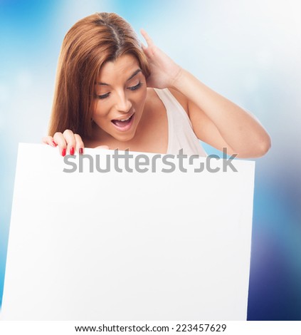 portrait of a beautiful young woman holding a white banner