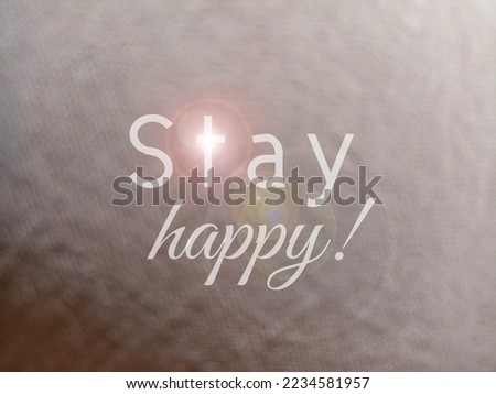 Life inspirational motivational quote - Stay happy. On brown blur abstract background with light. Happiness concept.