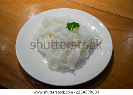 Thai style sticky rice noodle on wood table, stock photo