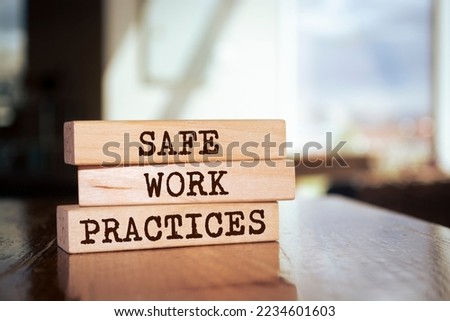 Wooden blocks with words 'Safe work practices'. Royalty-Free Stock Photo #2234601603