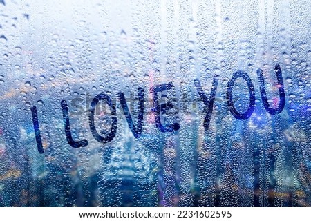 I love you words on a rainy windowpane