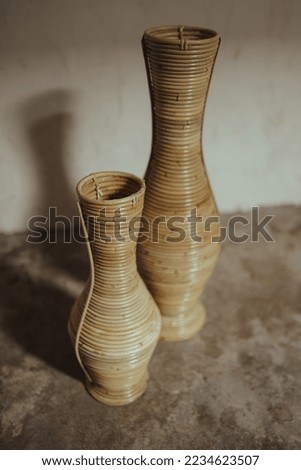 A flowerpot made of rattan that was neatly arranged and look good for photo studio property
