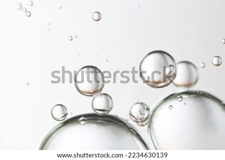 Large clear water bubbles, flow, rising.