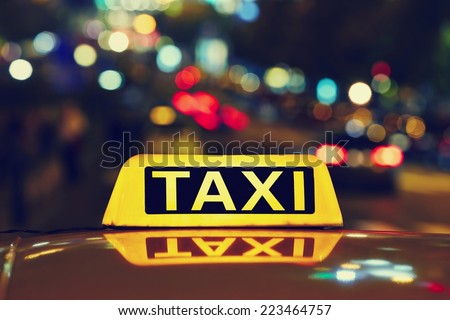 Taxi car on the street at night  Royalty-Free Stock Photo #223464757