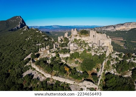 Aerial fly over the Château de Montferrand on the ridge of the Pic Saint Loup in Herrault, Occitanie, France