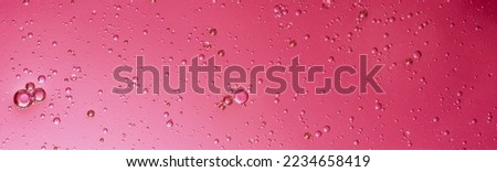 oil with bubbles on Trendy color of 2023 viva magenta. background. Abstract space background. Soft selective focus. macro of oil drops on water surface. copy space. air bubbles in water