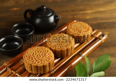 Close up moon cakes with wooden background. Mooncake is a traditional Chinese bakery. Often eating on Mid-Autumn Festival or lunar appreciation festival.