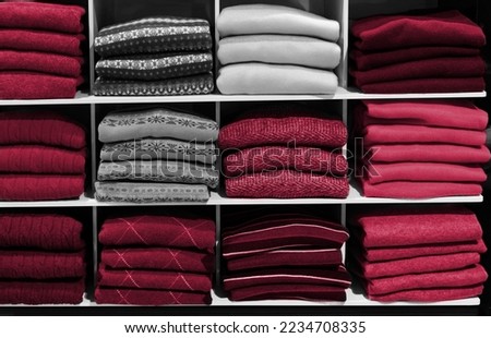 Multo color winter sweater on store shelves. New 2023 trending PANTONE 18-1750 Viva Magenta colour