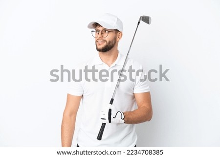 Handsome young man playing golf  isolated on white background thinking an idea while looking up