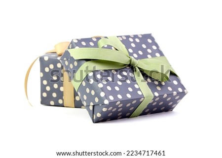 Gift boxes with ribbon bow isolated on white background. Wrapped Christmas or birthday green color gift boxes
