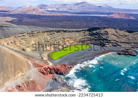 Green lake aerial view Charco de Los Clicos Verde near El Golfo on Lanzarote island travel on Canary Islands in Spain Royalty-Free Stock Photo #2234725413