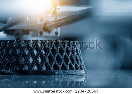 The additive manufacturing by 3D printer machine. The high technology manufacturing process by rapid prototype method.  Royalty-Free Stock Photo #2234728567